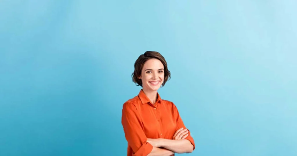 woman crossing arms on a blue background